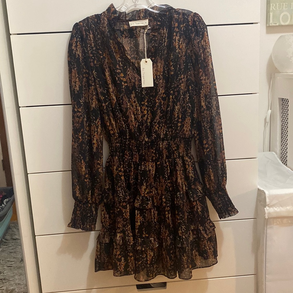 This is a long sleeve, shimmery dress that’s perfect for fall!